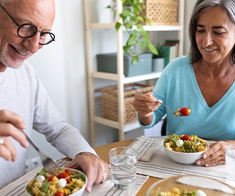 An older couple having healthy meals