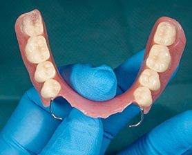 Houston patient smiling with partial denture filling gaps 