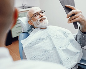 Male patient smiling in the mirror