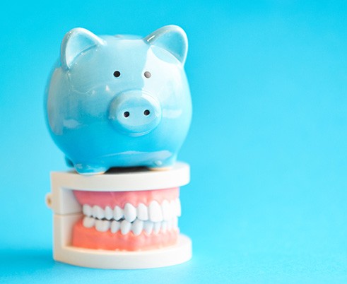 A blue piggy bank sitting on top of a jaw mockup