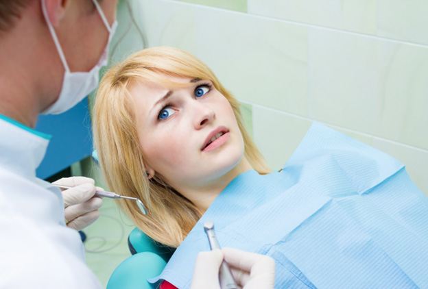 Woman afraid at the dentist