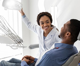 Patient in Houston talking to dentist about tooth extractions