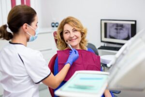 Older patient at her dental implant consultation